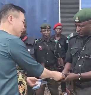 Unethical Conduct: Nigeria Police to Sanction Officers in Viral Video Receiving Cash from Chinese Nationals